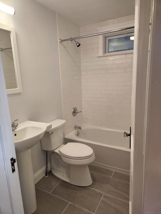 full bathroom with baseboards, a sink, shower / bath combination, tile patterned floors, and toilet