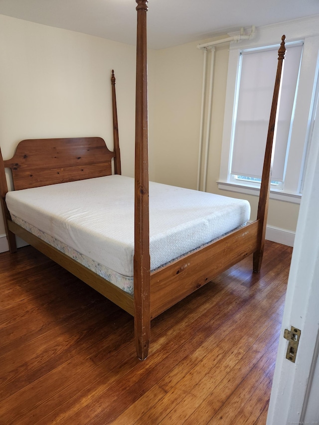 bedroom with wood finished floors