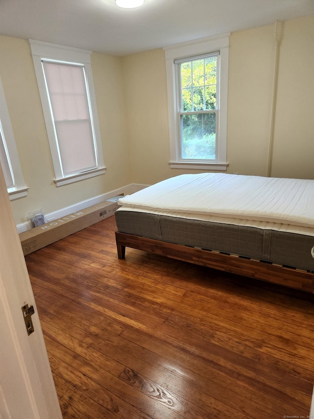 bedroom featuring wood finished floors