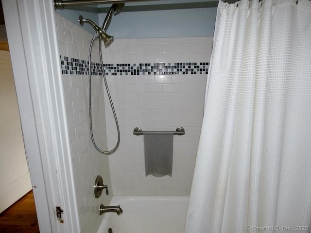 bathroom with shower / bath combination with curtain