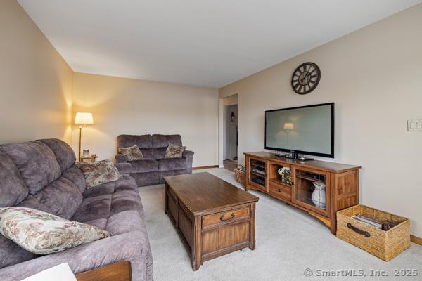 living room with light carpet