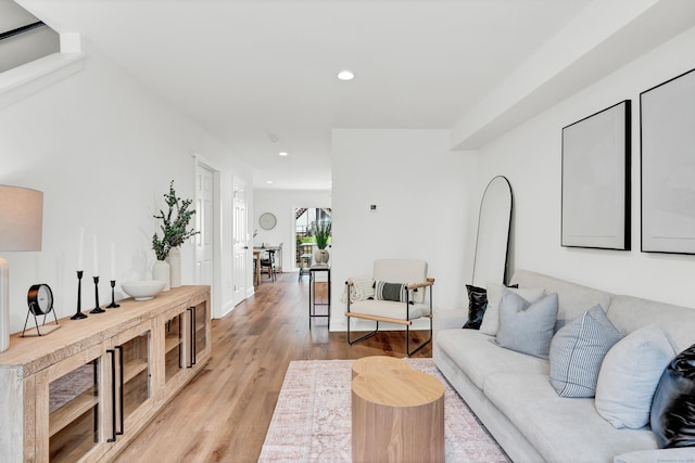 living room with recessed lighting and light wood-style floors