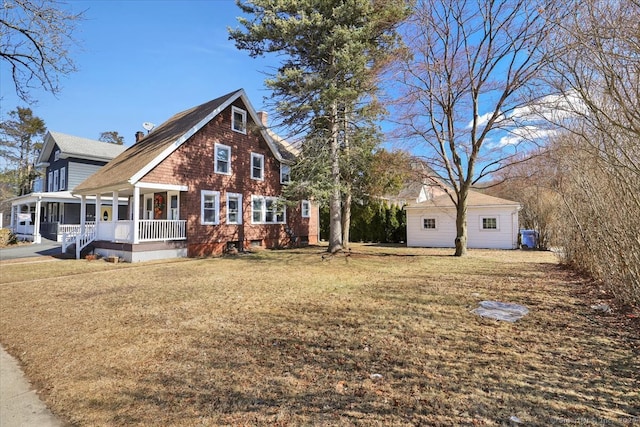 view of front of home featuring a front yard and covered porch