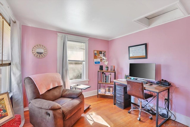 office featuring light wood-style flooring and baseboards