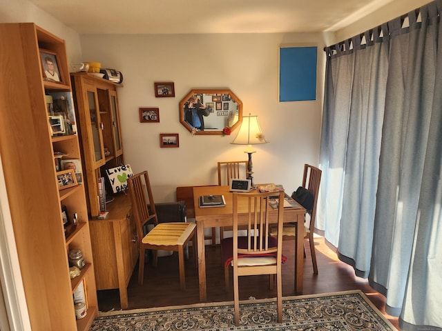 dining area with wood finished floors