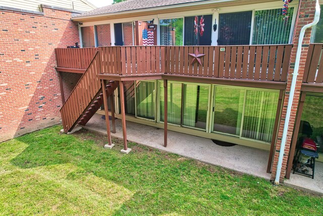 view of jungle gym featuring a patio and a lawn