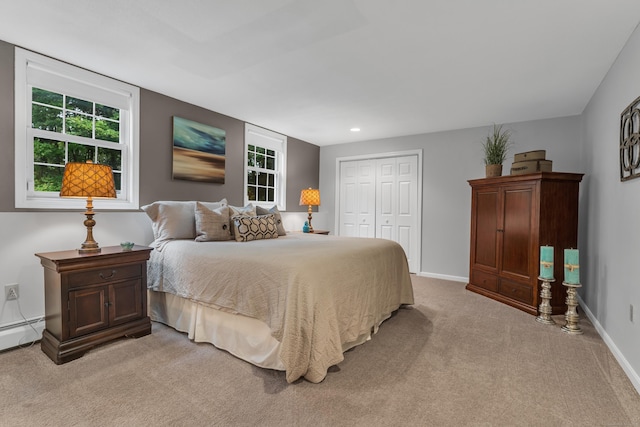 bedroom featuring recessed lighting, light colored carpet, a closet, and baseboards