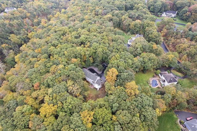 drone / aerial view featuring a view of trees