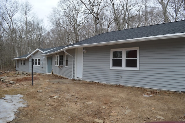 view of front of property with a shingled roof