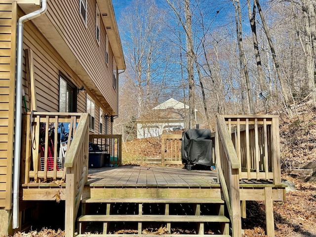 wooden terrace with area for grilling