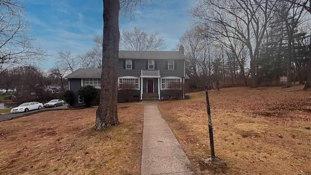 view of front of home with a balcony and crawl space