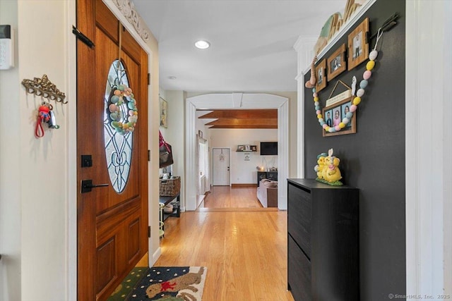 entrance foyer featuring baseboards and light wood finished floors