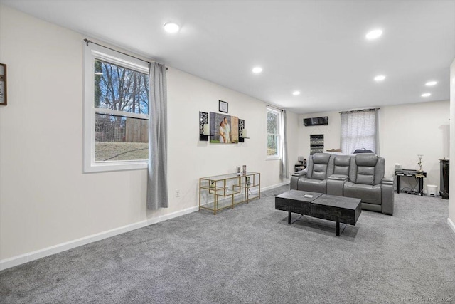 living room featuring recessed lighting, carpet, and baseboards