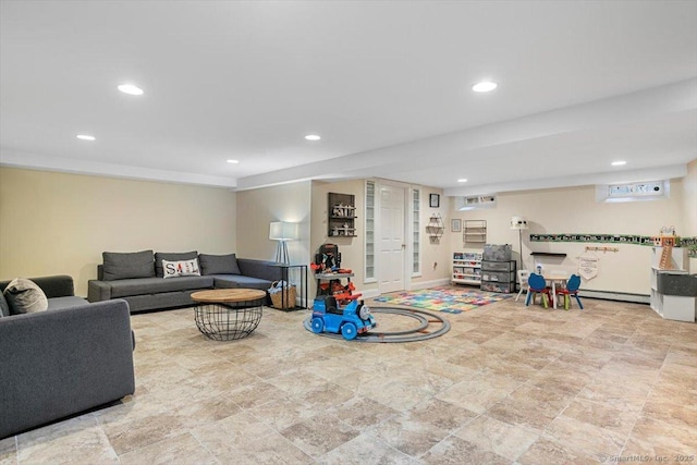 living room featuring recessed lighting and baseboard heating