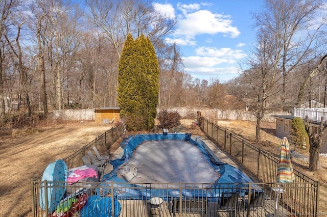 view of pool featuring a fenced in pool and fence