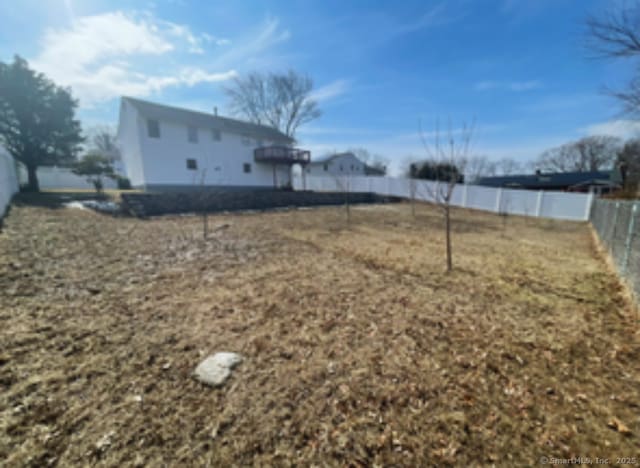 view of yard with a fenced backyard