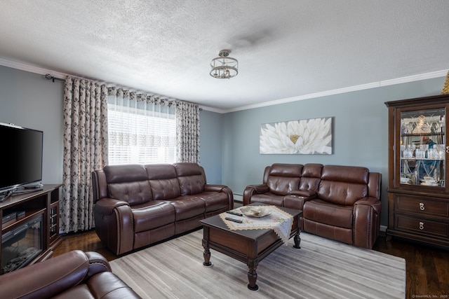 living room with a textured ceiling, wood finished floors, and crown molding