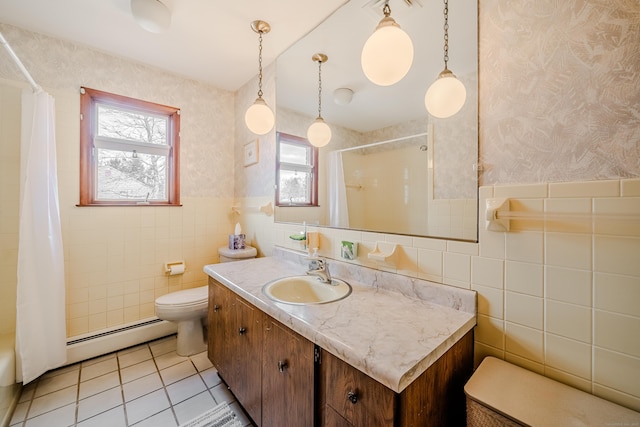 bathroom with tile walls, tile patterned floors, a baseboard radiator, toilet, and wallpapered walls