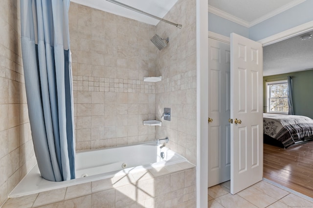 ensuite bathroom featuring tile patterned floors, connected bathroom, tiled shower / bath, and ornamental molding