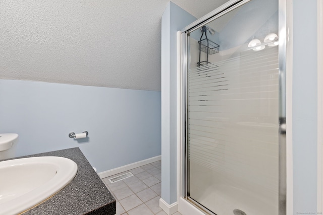 full bathroom with tile patterned flooring, visible vents, a stall shower, and a textured ceiling