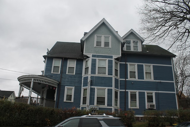 rear view of house with cooling unit