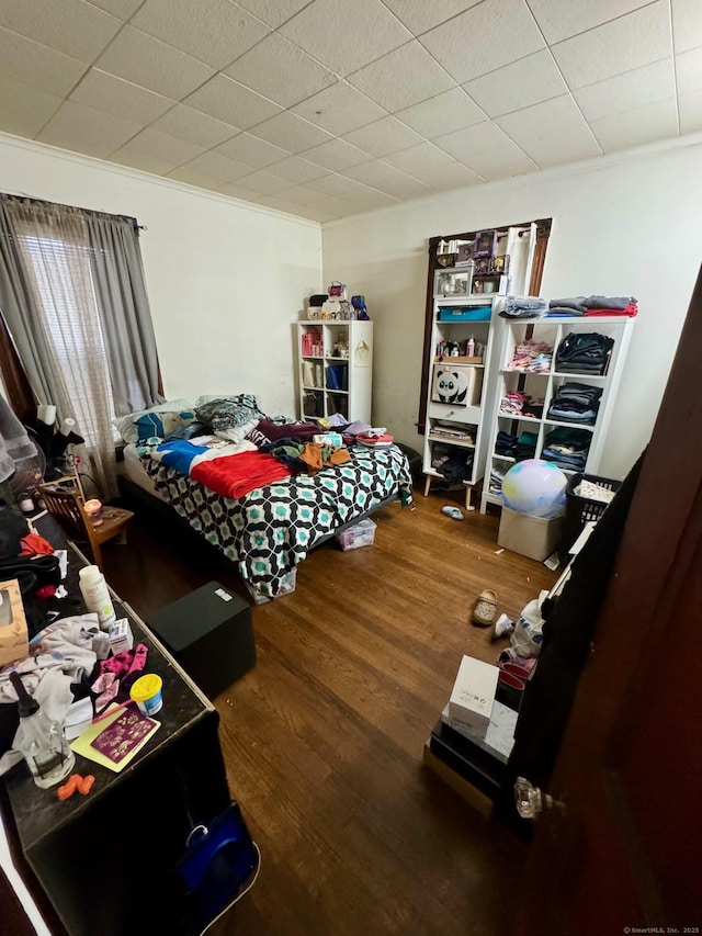 bedroom with wood finished floors