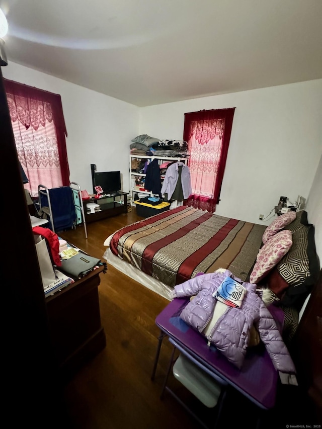 bedroom featuring wood finished floors