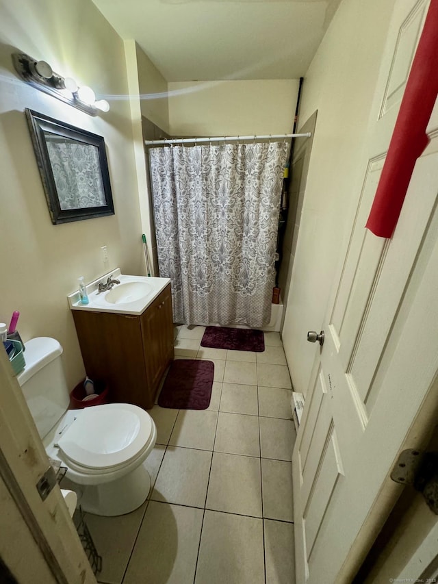 bathroom featuring tile patterned floors, toilet, and vanity