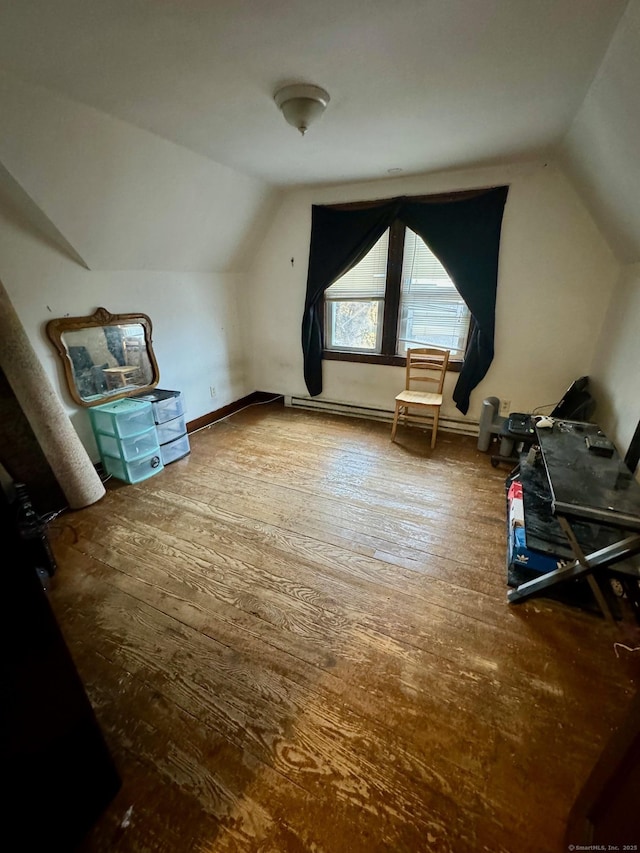 bonus room featuring lofted ceiling and wood-type flooring