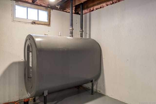 interior details featuring finished concrete flooring and heating fuel