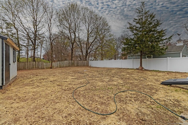 view of yard with a fenced backyard