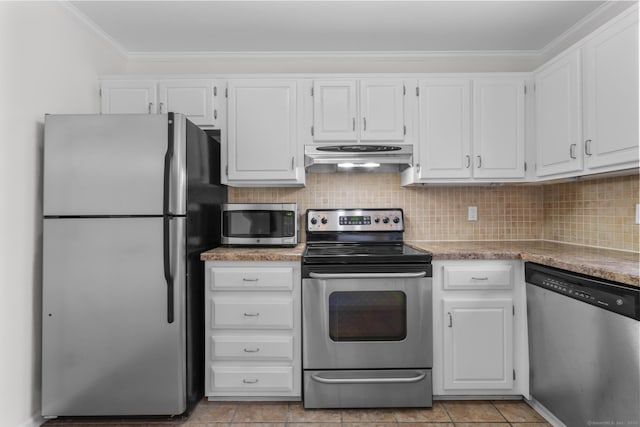 kitchen featuring tasteful backsplash, ventilation hood, stainless steel appliances, white cabinets, and crown molding