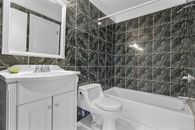 full bath with vanity, bathing tub / shower combination, tile walls, toilet, and marble finish floor