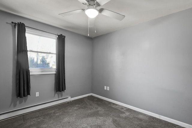 empty room with ceiling fan, a baseboard heating unit, baseboards, and dark colored carpet