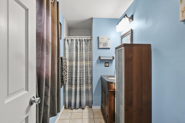 full bathroom featuring tile patterned floors, vanity, and a shower with curtain