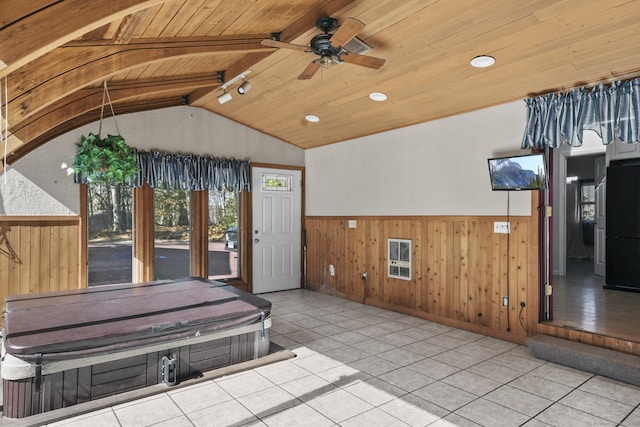 interior space with a ceiling fan and an indoor hot tub