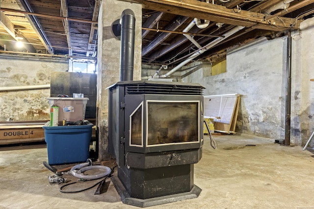 basement featuring a wood stove