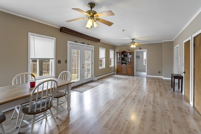 interior space featuring baseboards, ornamental molding, french doors, light wood-style floors, and a baseboard radiator