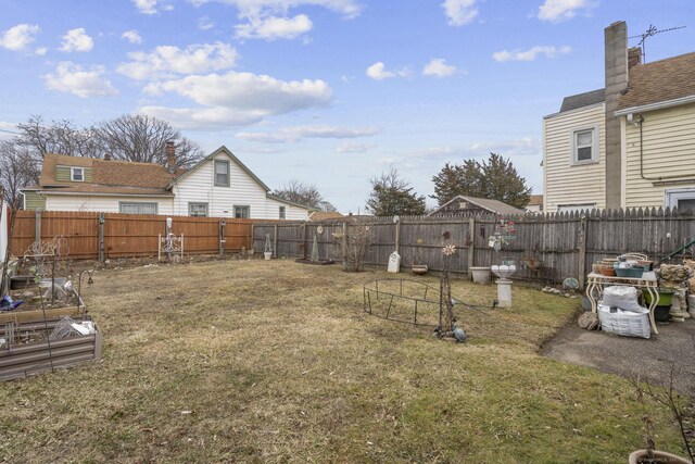 view of yard featuring a fenced backyard