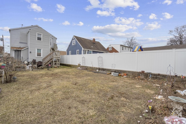 view of yard with a fenced backyard