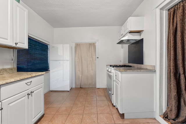 kitchen with white cabinetry, white appliances, light countertops, and under cabinet range hood