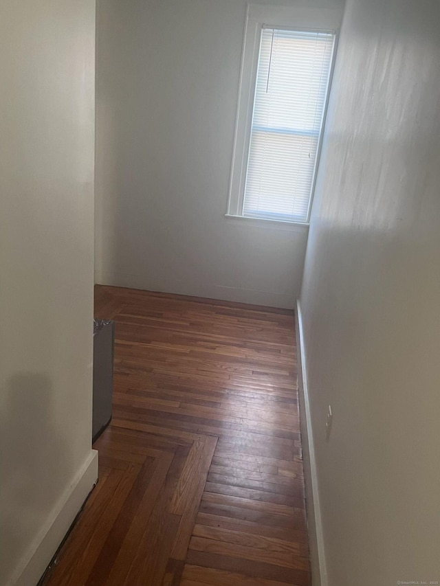 spare room featuring baseboards