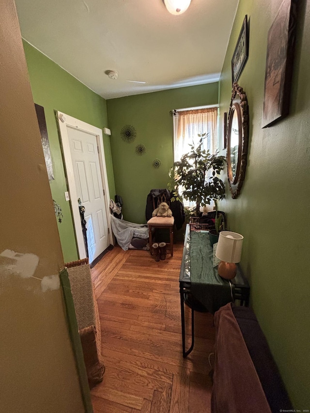 hall with wood finished floors