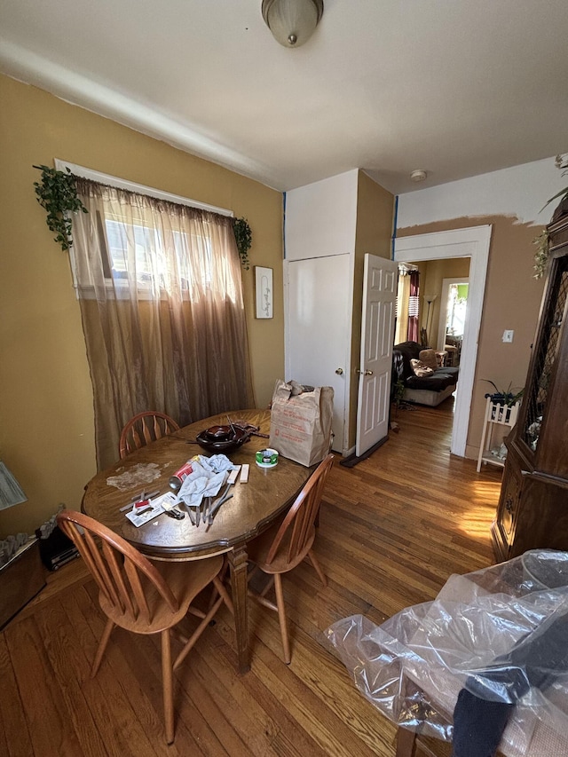 dining space with a healthy amount of sunlight and wood finished floors