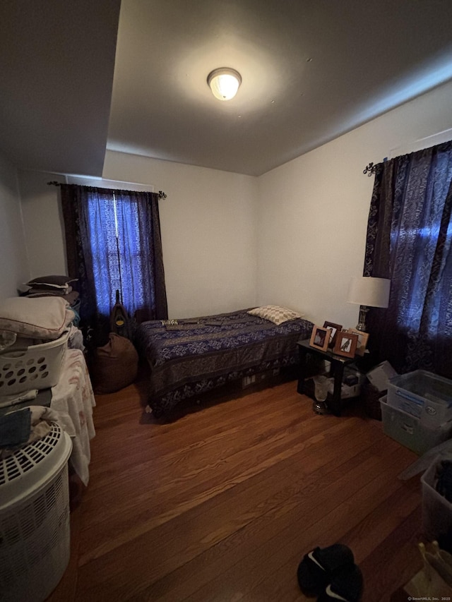 bedroom with wood finished floors