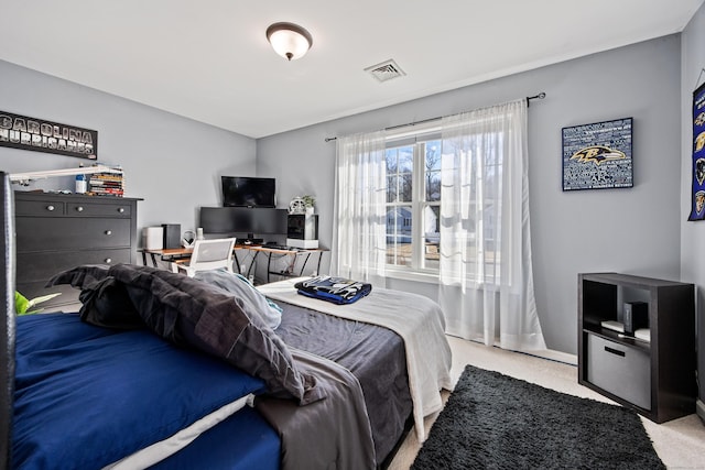 bedroom featuring visible vents, baseboards, and carpet floors