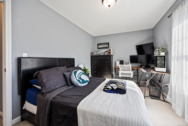 carpeted bedroom with baseboards