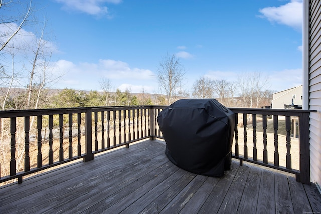 wooden deck featuring area for grilling