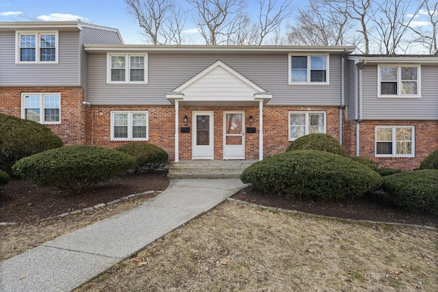 multi unit property featuring brick siding