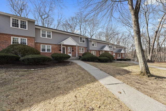 view of front of house with brick siding